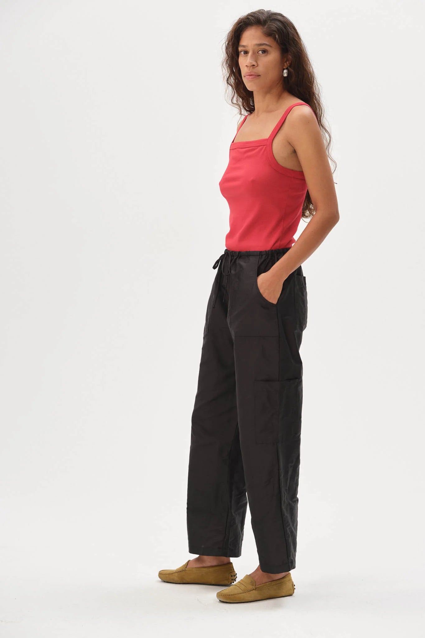 Person wearing taffeta silk cargo pant black pants on a white background Donni Vancouver Shipping Canada Paloma